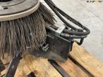 Front brushes for sweep-week machine 18