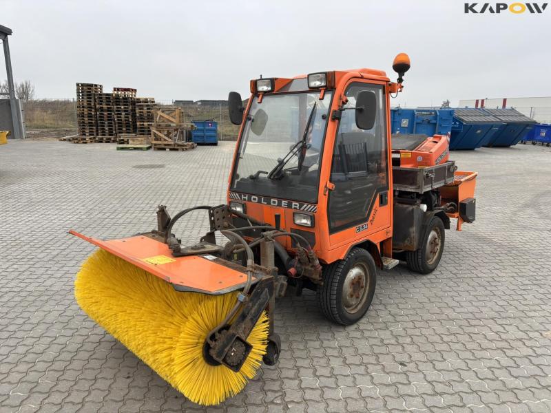 Holder C2.34 with broom and salt spreader 1